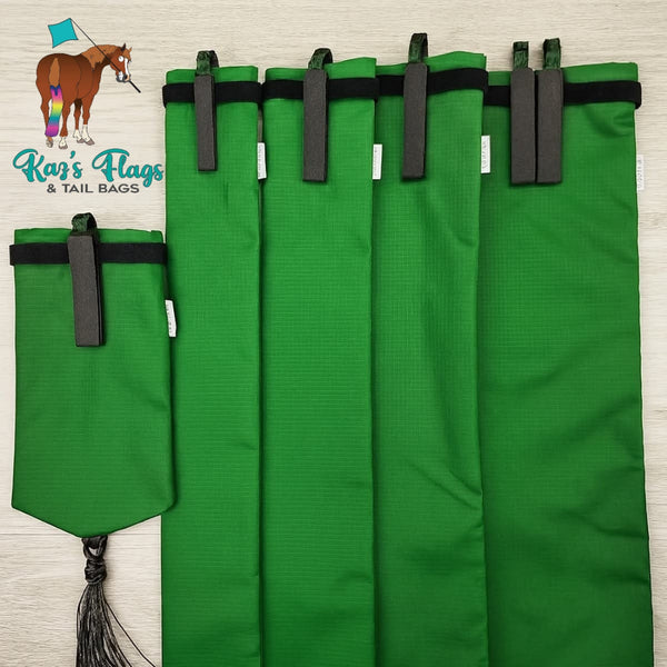 Green horse tail bags with black velcro on a light wooden background, handmade by Kaz's Flags & Tail Bags logo.
