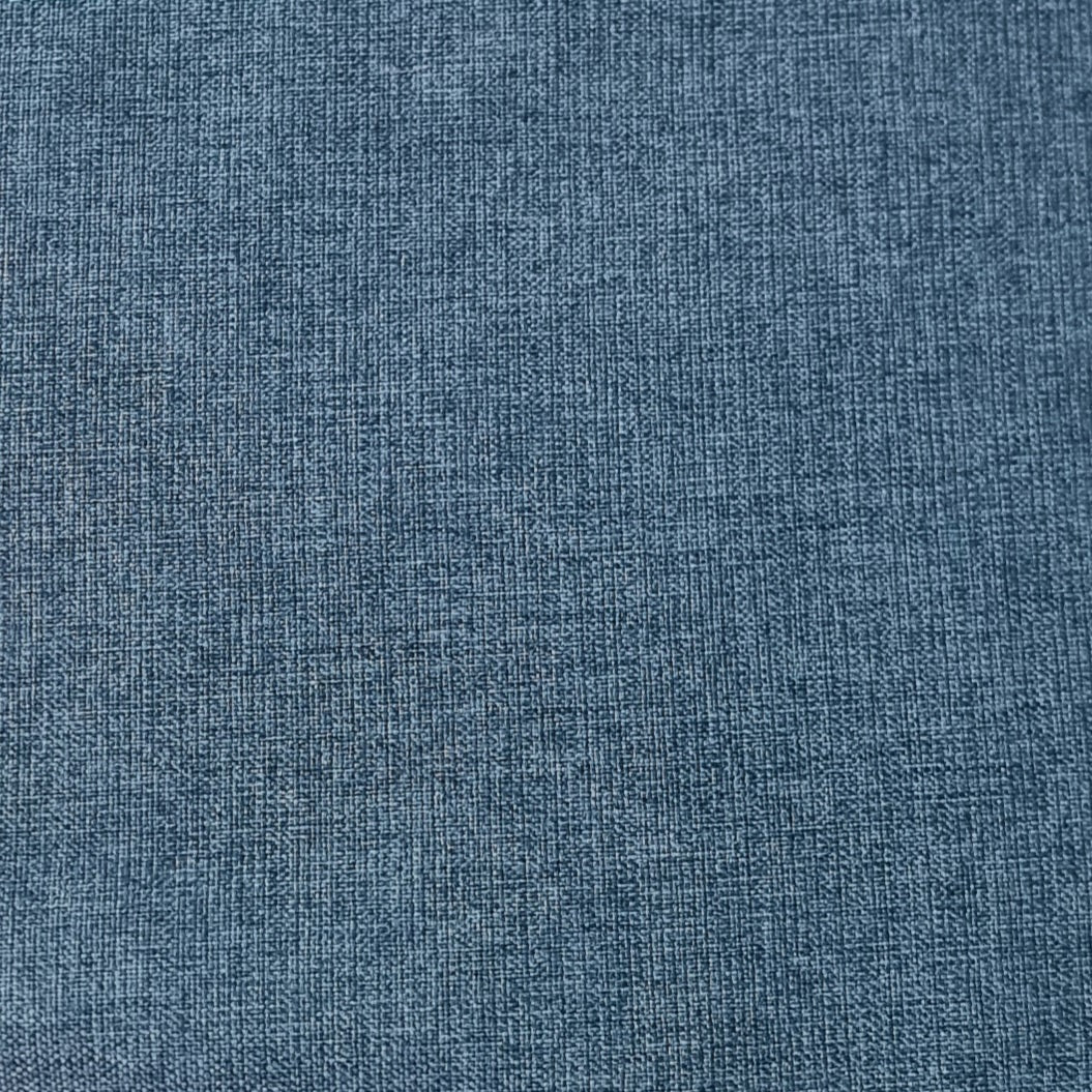 A close-up texture shot of a blue woven fabric, showing a detailed linen-like weave pattern.