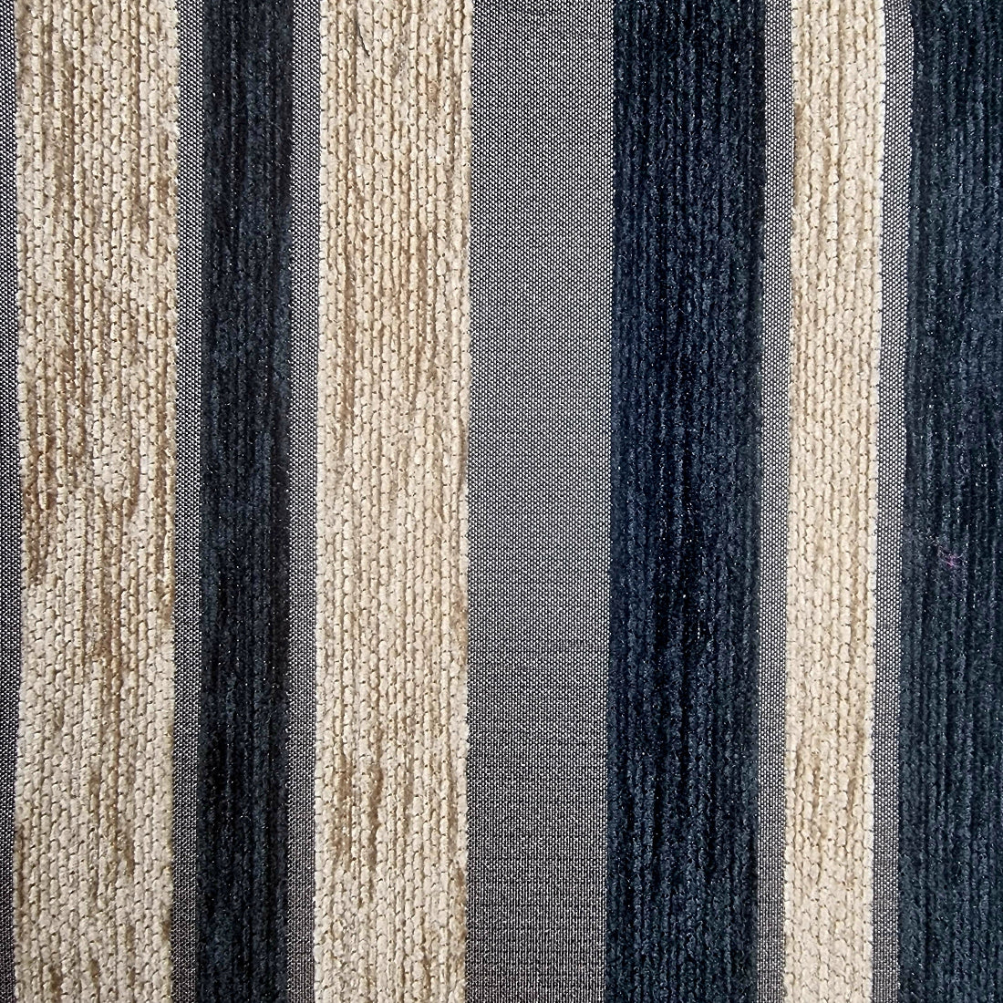 Close-up of a fabric with blue and beige striped pattern