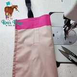 pink tail bag with cream sewn in liner