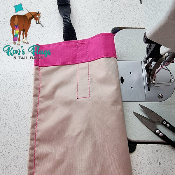 pink tail bag with cream sewn in liner