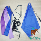 A set of equestrian tail flags and reins laid out on a light wood background, including a blue and purple ribbon flag, a blue flag with a silver pole, black reins, and a blue-and-black lead. The 'Kar's Flags & Tail Bags' logo is visible in the bottom right corner.