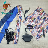 Horse riding equipment including a blue flag, colorful patterned flag, and a black treat pouch  on a wooden floor.