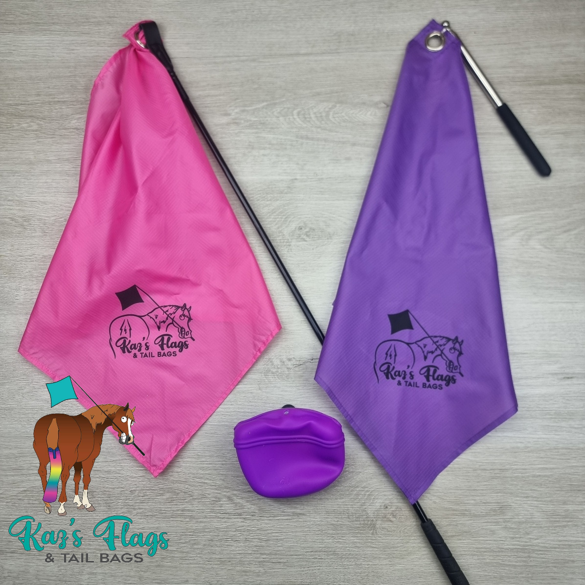 Two equestrian flags in bright pink and purple, each with a black-handled stick, a small purple zip pouch, and a logo reading 'Ker's Flags & TAIL BAGS' printed on the fabric, arranged on a light wood floor.