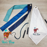 A set of equestrian flag accessories laid out on a light wood surface, including a white flag with logo, blue and teal strippy flags and a liberty whip combo. A logo for 'Kaz's Flags & Tail Bags' appears in the lower left.
