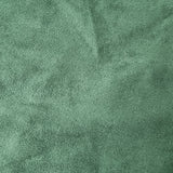 A close-up of a textured green fabric surface with a soft, slightly mottled finish.