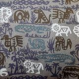 Patterned fabric with animal and nature designs in brown, blue, and light grey on a grey background.