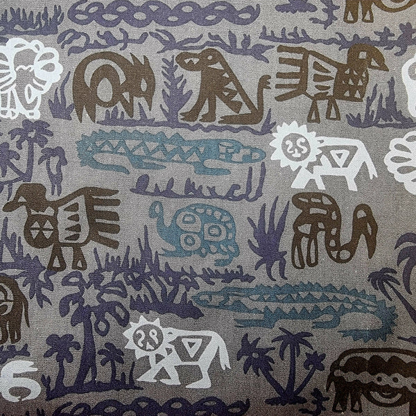 Patterned fabric with animal and nature designs in brown, blue, and light grey on a grey background.