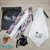 Flat lay display with White Flag with Kaz Flag logo on and a Strippy Flag and a drawstring black bag.