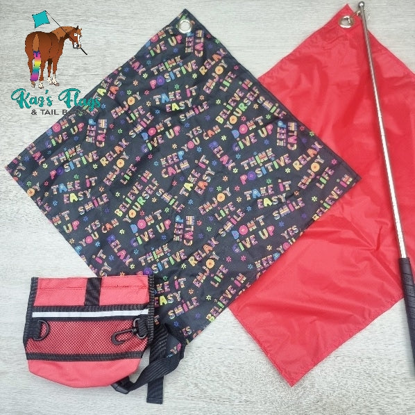 Flags and training pouch laying on light coloured board.