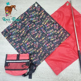 Flags and training pouch laying on light coloured board.